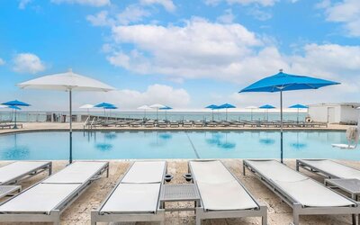 Relaxing sun loungers at Ramada Plaza Marco Polo Beach Resort.