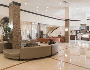 Lobby seating at Ramada Plaza Marco Polo Beach Resort.