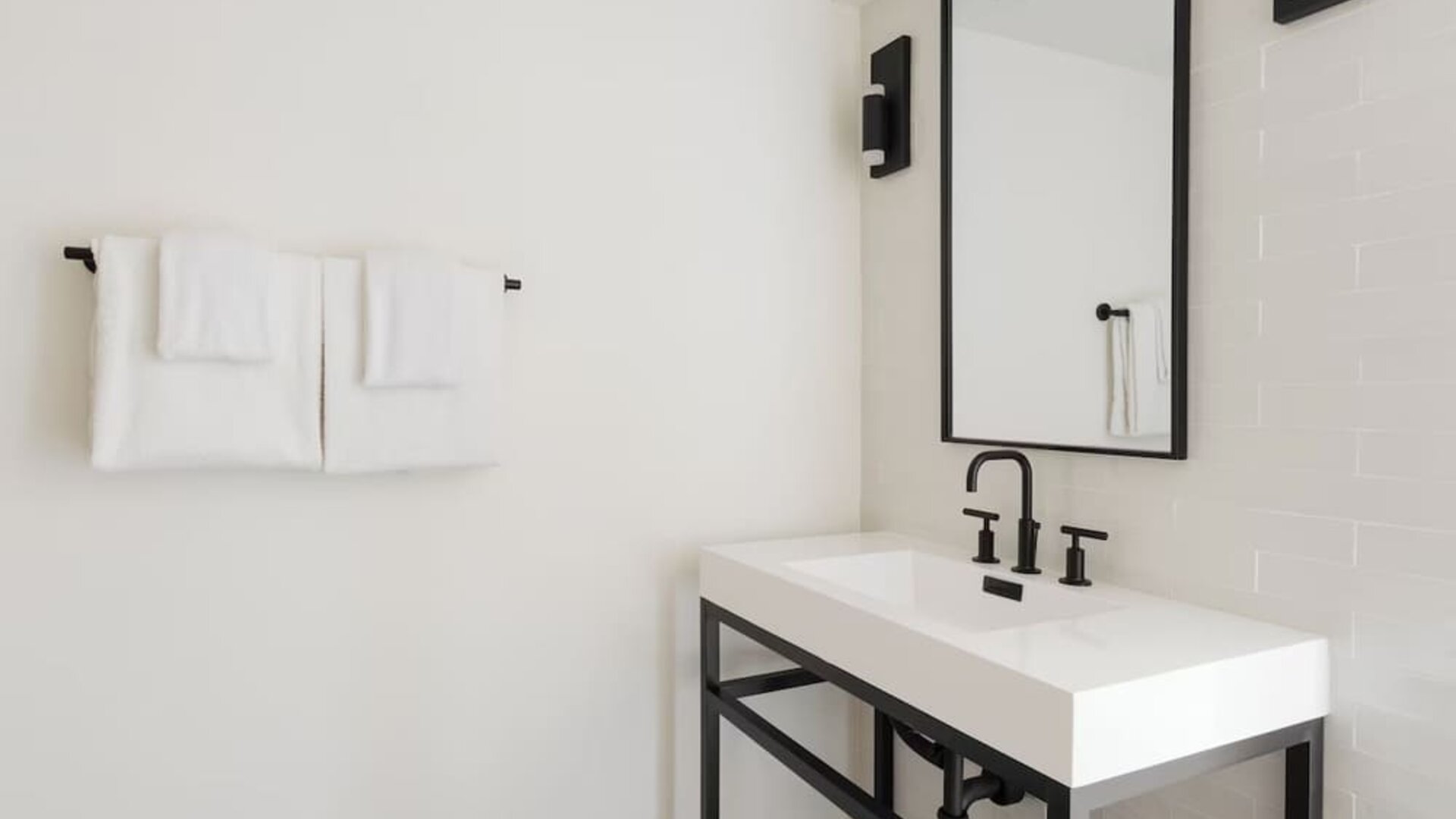 Guest bathroom with shower at Lum Hotel Inglewood.