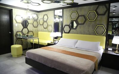 Simple king room at Victoria Court Las Piñas.