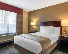 Comfortable king guest room featuring plush bedding, modern furnishings, and convenient in-room amenities at Best Western Braintree.
