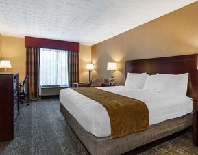 Bright guest room featuring natural light, king bed, workspace, and modern amenities at Best Western Braintree.