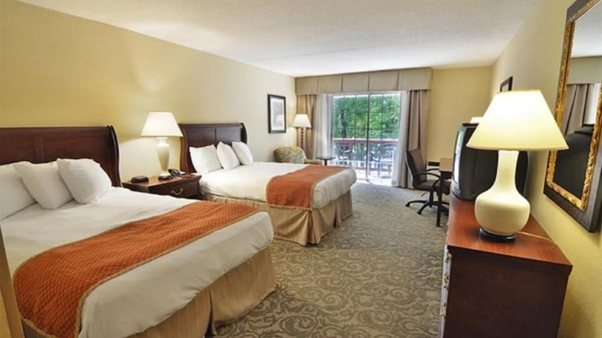 Sturbridge Host Hotel.
Double queen guest room offering comfortable accommodations, work desk, and balcony access at Sturbridge Host Hotel.