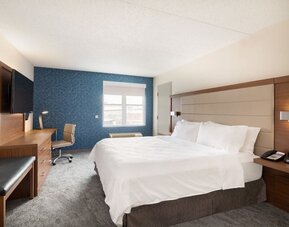King guest room featuring premium bedding, ergonomic workspace, and thoughtfully designed amenities at Holiday Inn Express & Suites Boston-Cambridge.