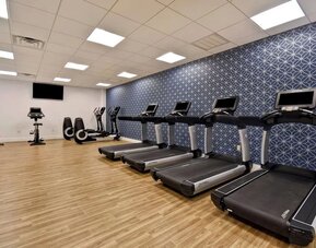 Well-equipped fitness center featuring treadmills, cardio machines, and workout equipment to help guests maintain their fitness routine at Four Points by Sheraton Boston-Newton.