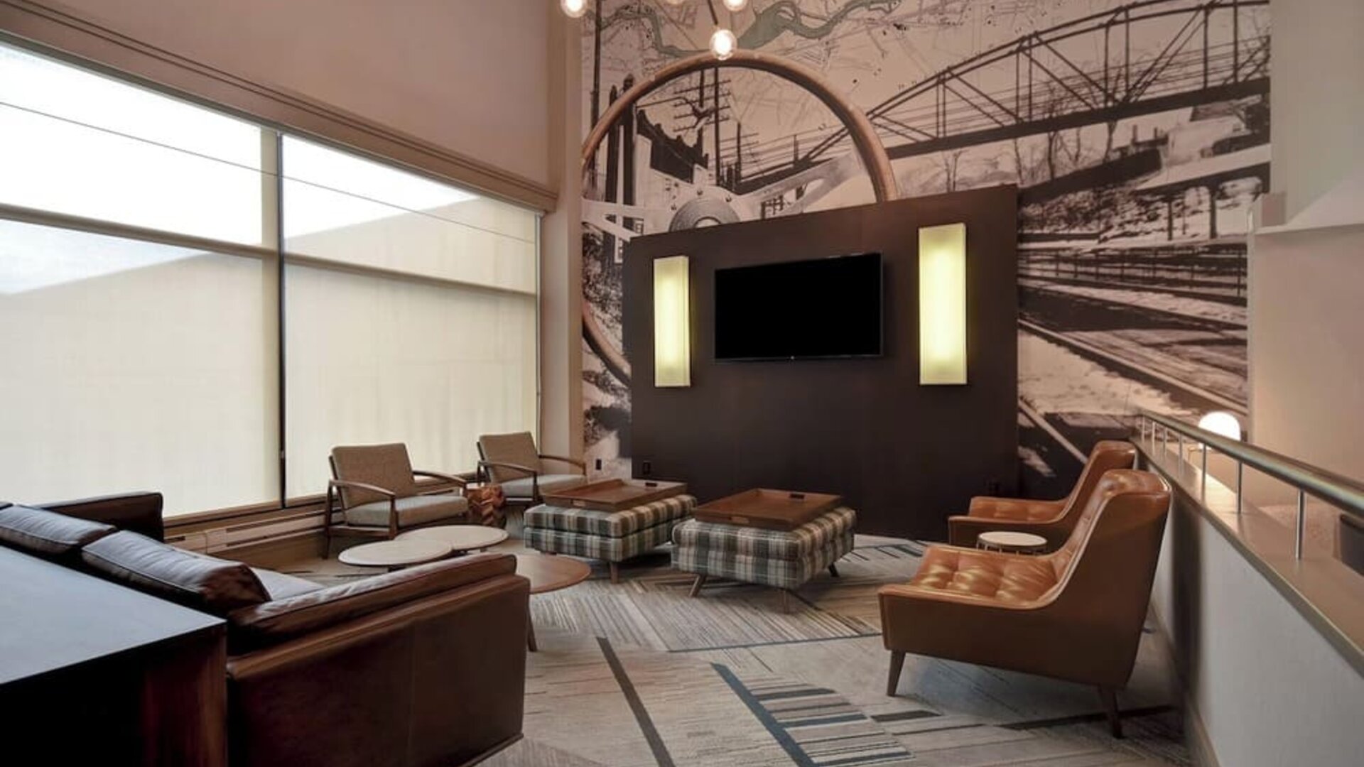 Comfortable hotel lounge featuring modern furnishings, unique décor, and inviting spaces for relaxing or socializing at Four Points by Sheraton Boston-Newton.