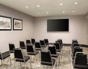 Flexible meeting room equipped for presentations, training sessions, corporate gatherings, and small events at Courtyard by Marriott Boston Brookline.