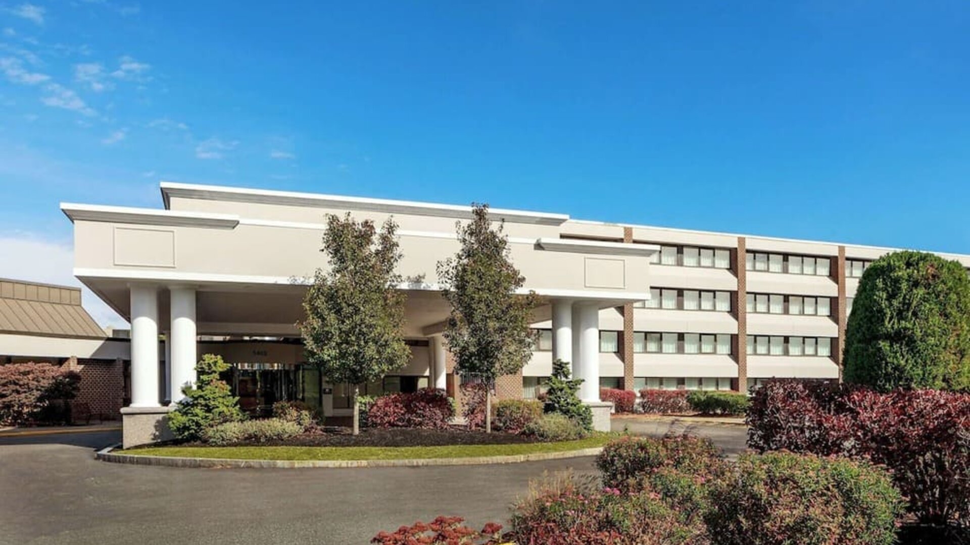 Exterior view showcasing the hotel’s welcoming entrance, landscaped grounds, and convenient access for guests arriving at DoubleTree by Hilton Westborough.