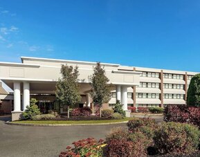 Exterior view showcasing the hotel’s welcoming entrance, landscaped grounds, and convenient access for guests arriving at DoubleTree by Hilton Westborough.
