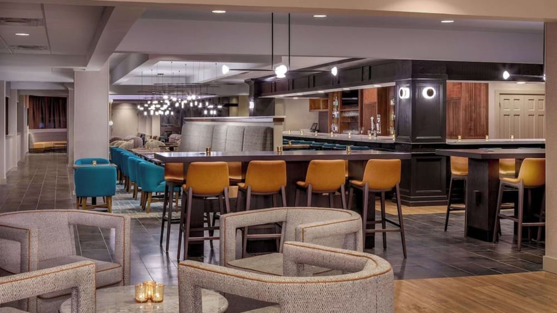 Stylish restaurant and lounge area featuring modern décor, comfortable seating, and a welcoming atmosphere for dining and cocktails at DoubleTree by Hilton Westborough.