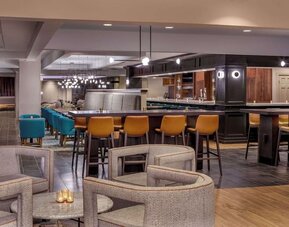 Stylish restaurant and lounge area featuring modern décor, comfortable seating, and a welcoming atmosphere for dining and cocktails at DoubleTree by Hilton Westborough.