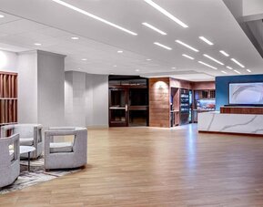 Expansive reception and lobby area offering contemporary furnishings, open gathering spaces, and convenient guest services at DoubleTree by Hilton Westborough.