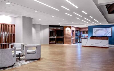 Expansive reception and lobby area offering contemporary furnishings, open gathering spaces, and convenient guest services at DoubleTree by Hilton Westborough.