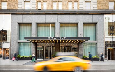 Main entrance of Row NYC featuring a contemporary façade, elegant lighting, and a welcoming arrival experience in the heart of New York City.