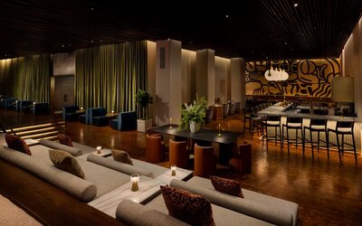 Expansive social lounge featuring contemporary seating, a stylish bar, and versatile gathering spaces designed for connection and comfort at Row NYC.