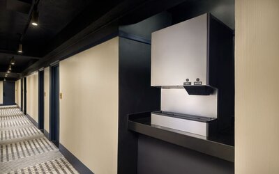 Convenient guest hydration station providing complimentary ice and water access along the guest room corridor at Row NYC.