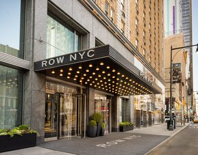 Street-level entrance of Row NYC featuring signature marquee lighting, modern architecture, and a welcoming arrival experience in New York City.
