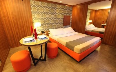 King room with red color theme at Victoria Court Hillcrest.