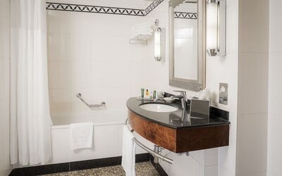 Guest bathroom with shower at Hilton London Paddington.