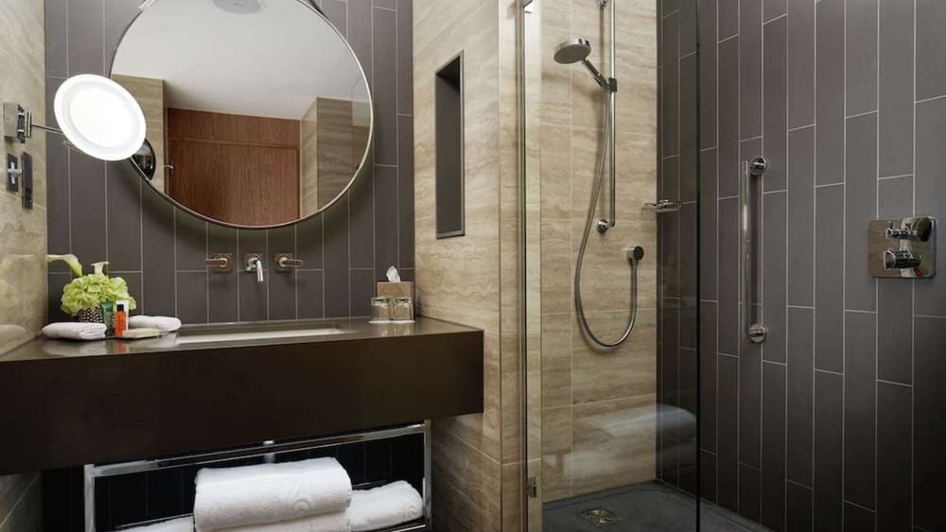 Guest bathroom with shower at Hilton London Bankside. 