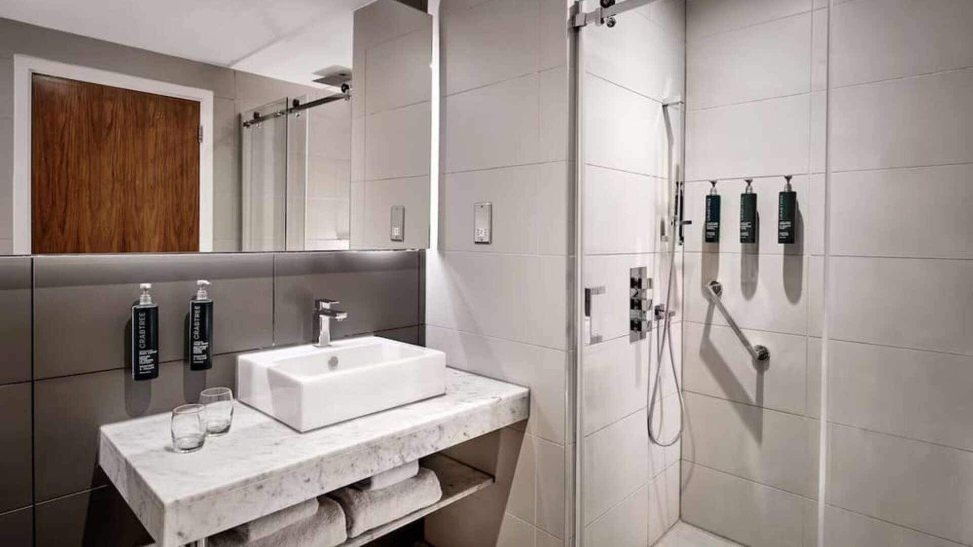 Guest bathroom with shower at DoubleTree By Hilton Lincoln.