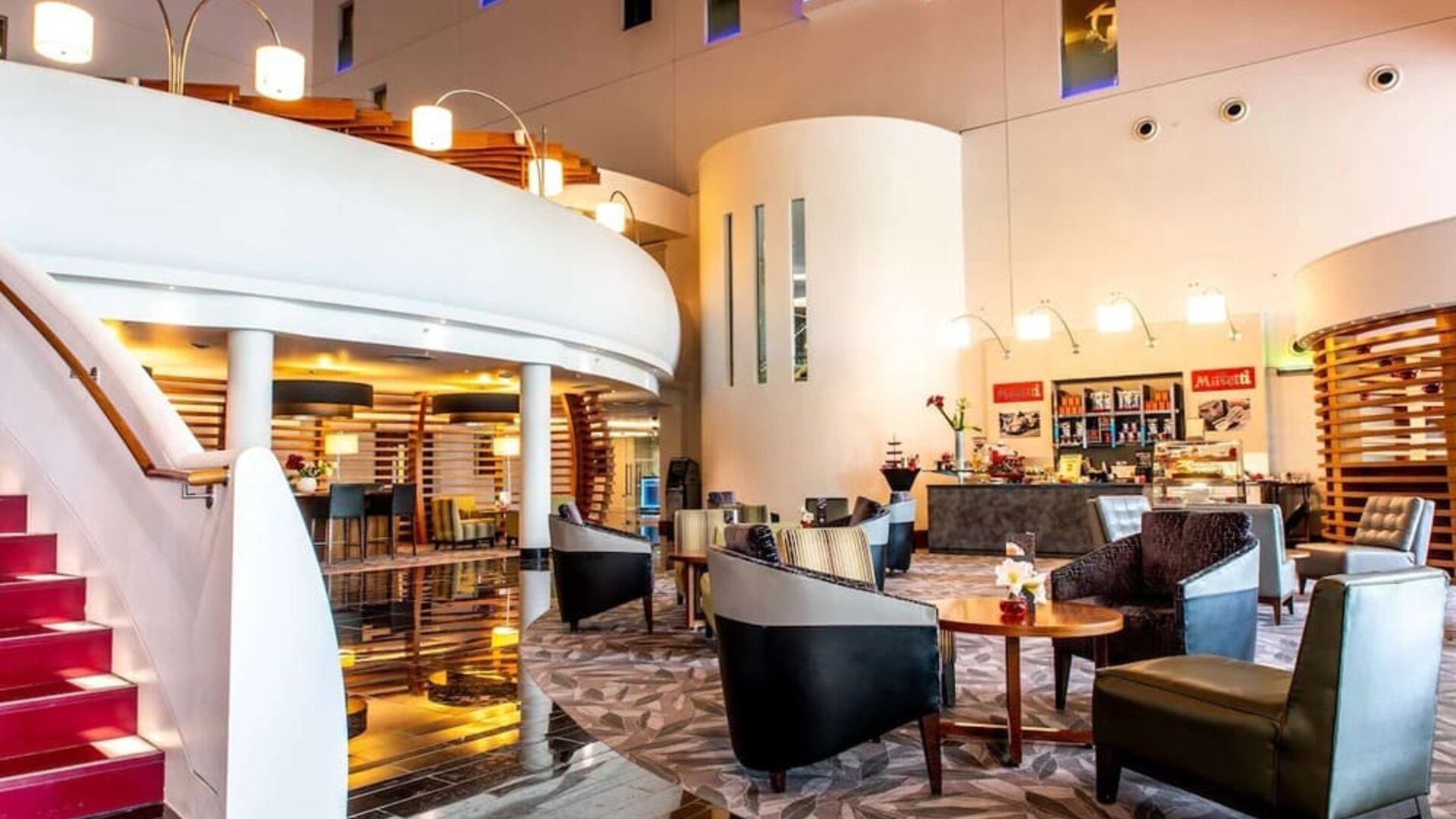 Lobby and coworking lounge at Hilton London Heathrow Airport Terminal 5.