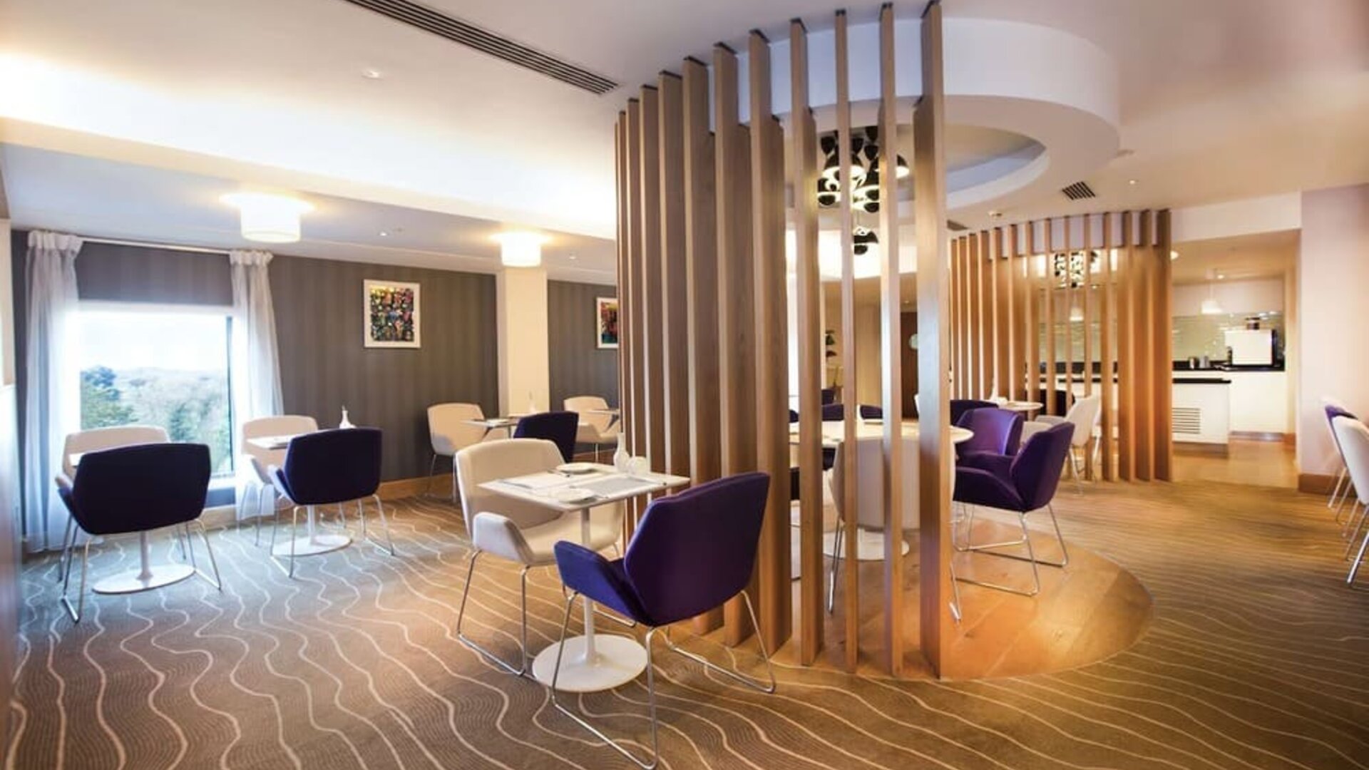 Lobby and coworking lounge at Hilton London Heathrow Airport Terminal 5.