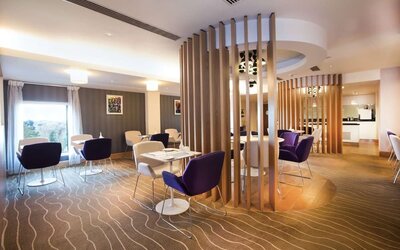 Lobby and coworking lounge at Hilton London Heathrow Airport Terminal 5.