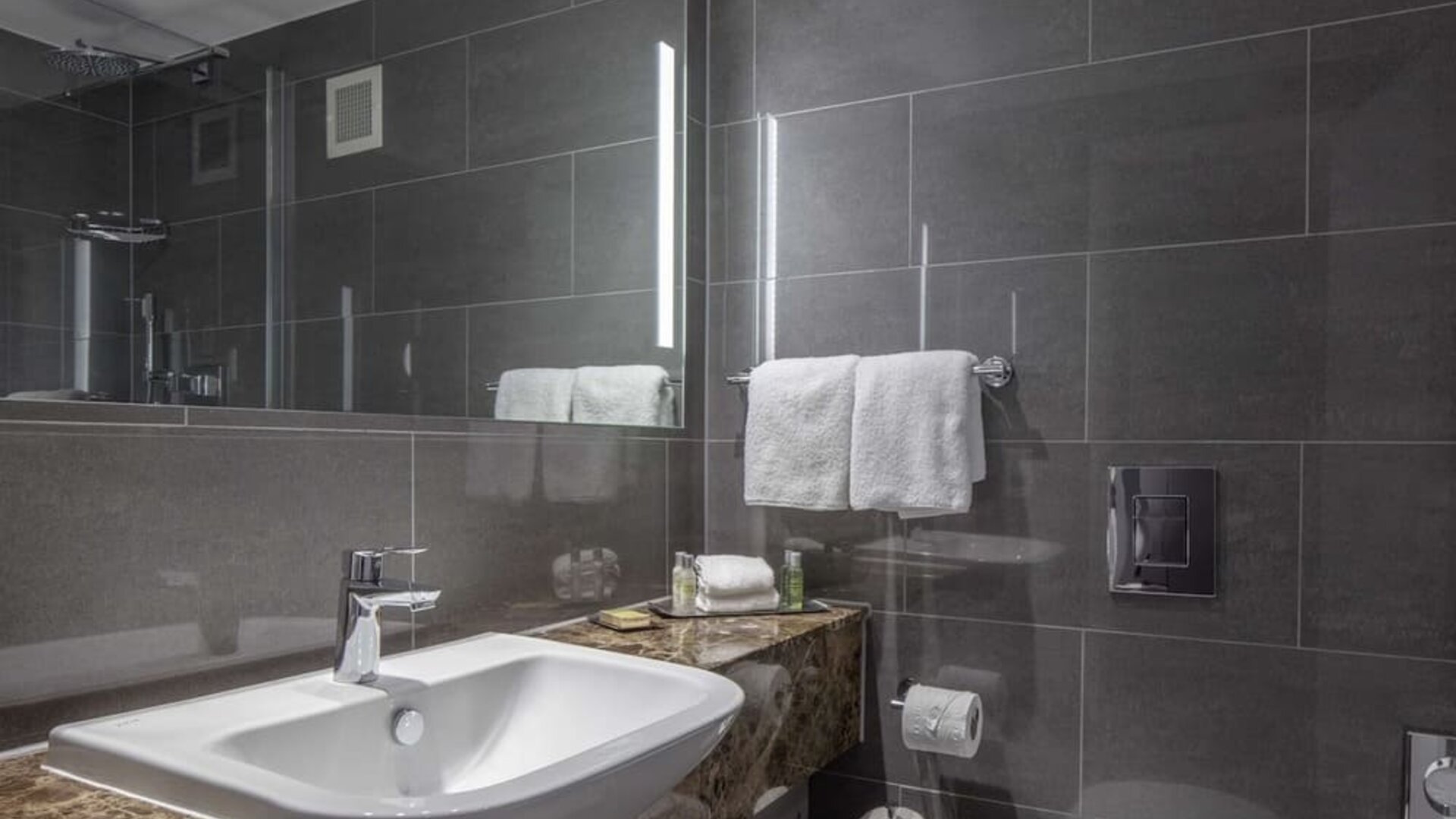Guest bathroom with shower at DoubleTree By Hilton Bristol City Centre.  