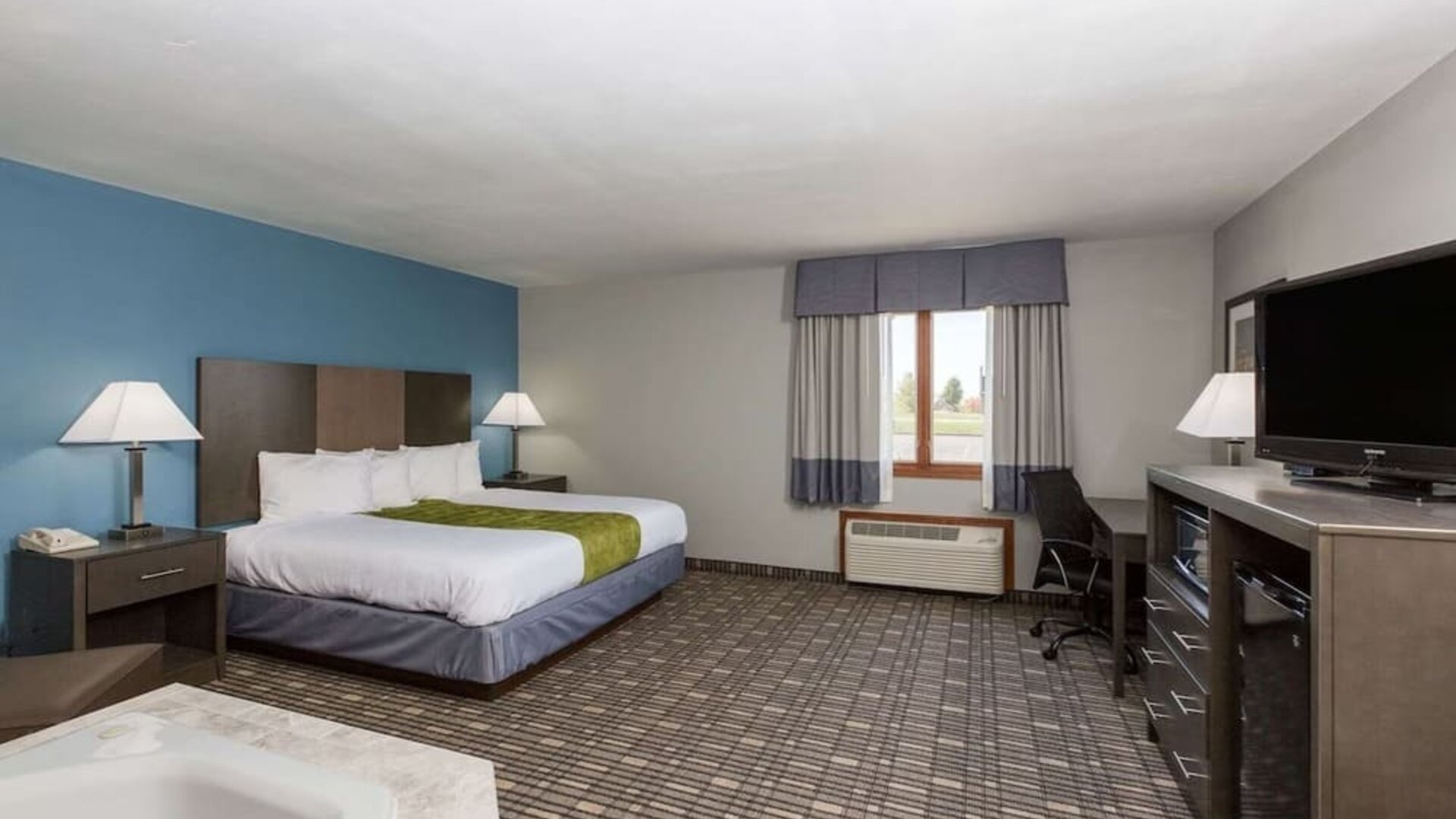 Spacious king suite with jacuzzi bath at Baymont By Wyndham Pella.