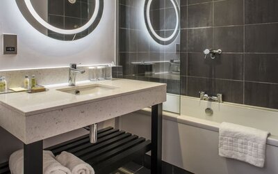 Guest bathroom with shower and tub at DoubleTree By Hilton Bristol South - Cadbury House.