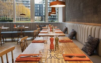 Spacious dining area perfect for coworking at Lincoln Plaza London, Curio Collection By Hilton.