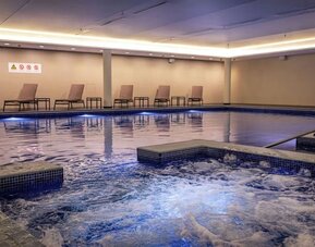 Refreshing indoor pool at Lincoln Plaza London, Curio Collection By Hilton.