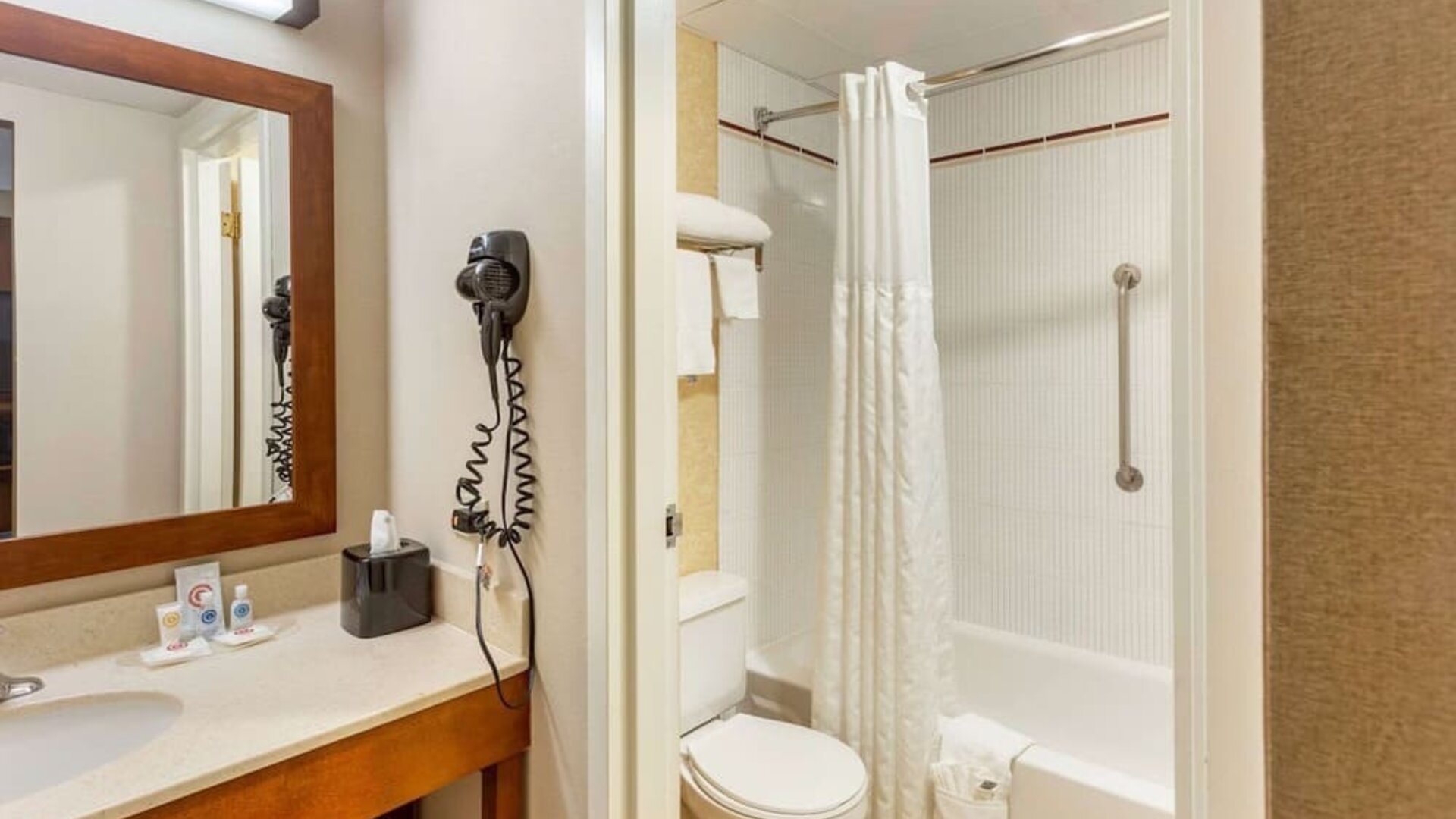 Private bathroom with shower at Comfort Suites Oakbrook Terrace.