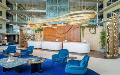 Stylish lobby and coworking lounge at Hilton London Heathrow Airport.
