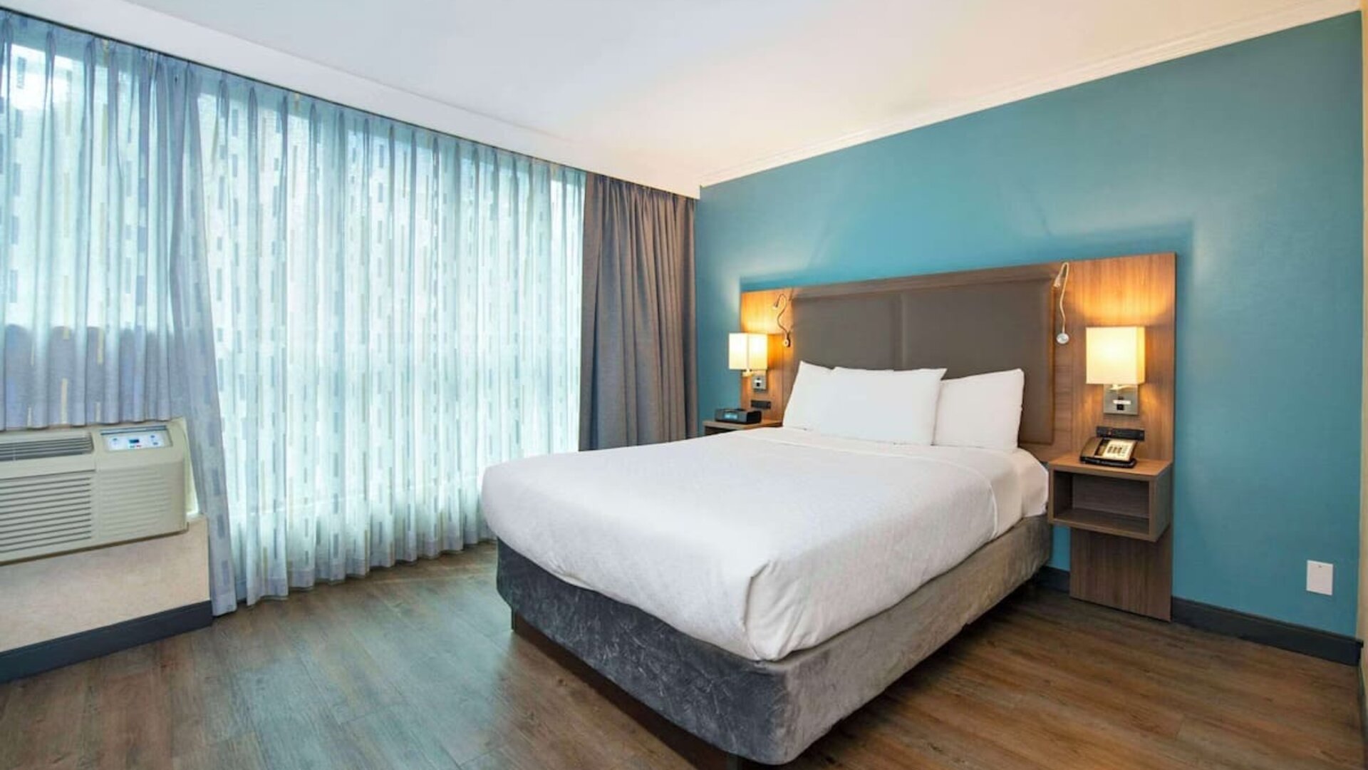 Romantic king room with natural light at Grand Park Hotel & Suites Downtown Vancouver.