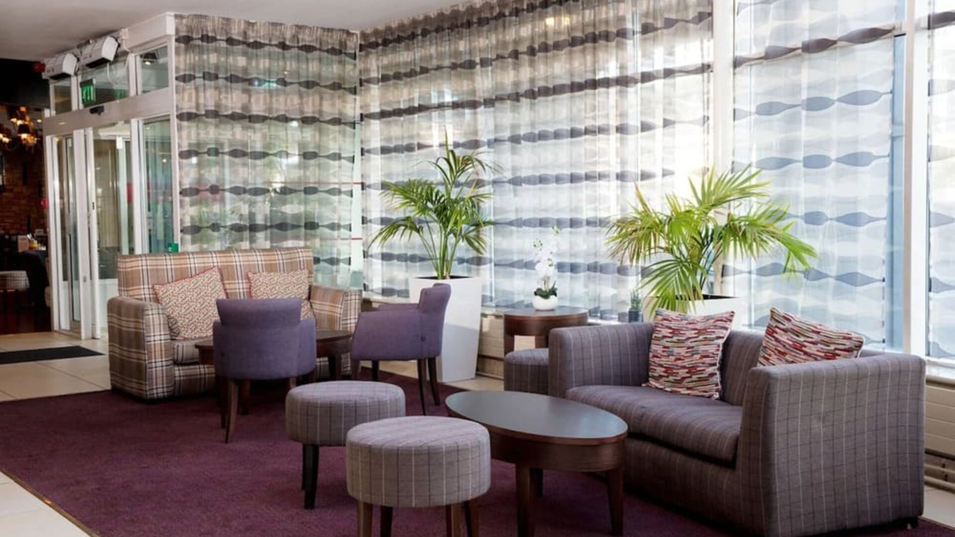 Lobby and coworking lounge at Leonardo Hotel Cork.
