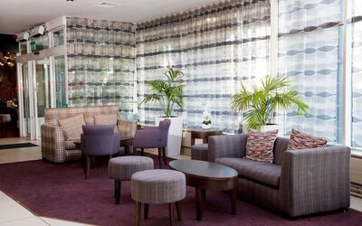 Lobby and coworking lounge at Leonardo Hotel Cork.
