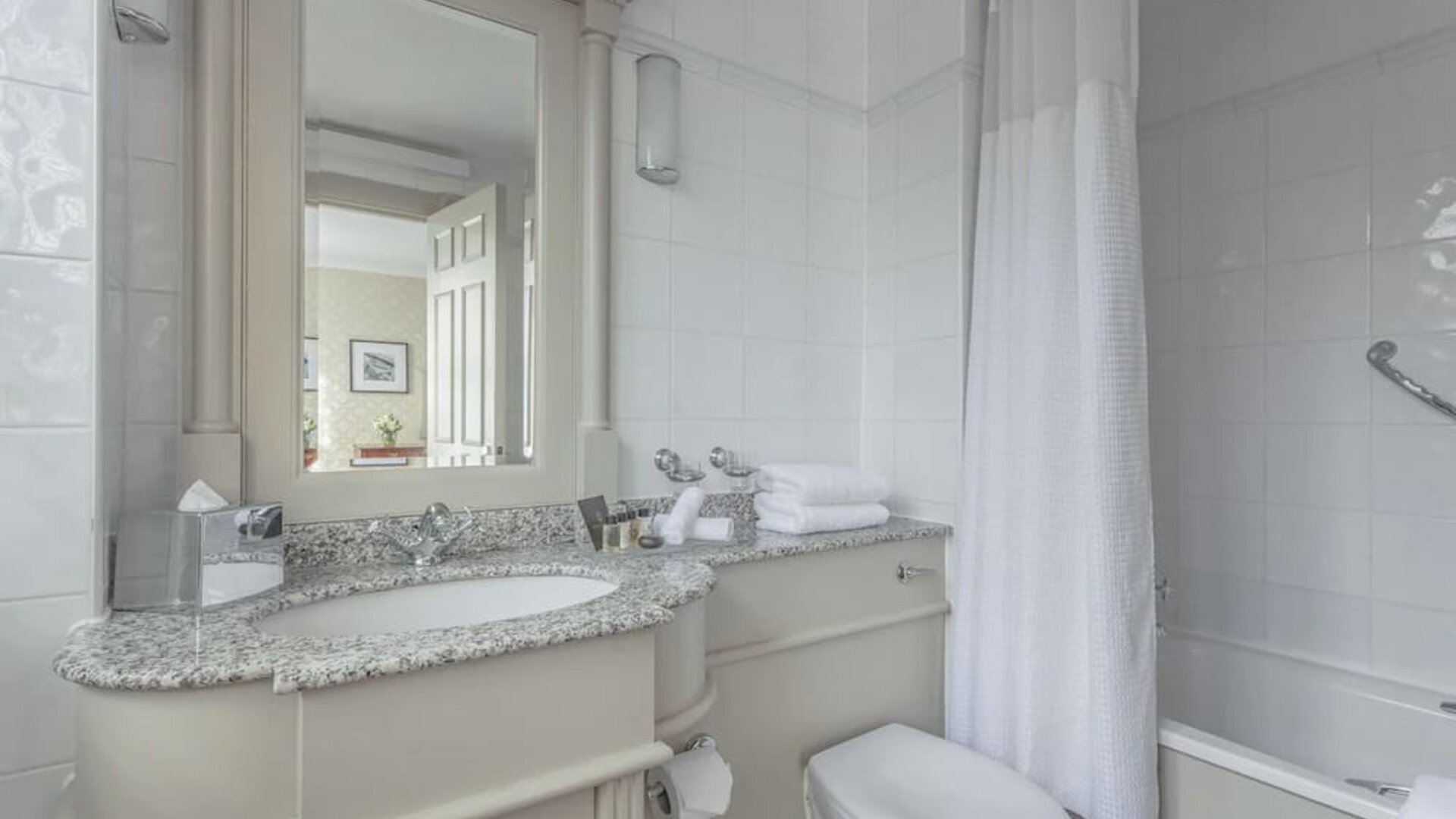 Guest bathroom with shower and tub at The Grand Brighton. 