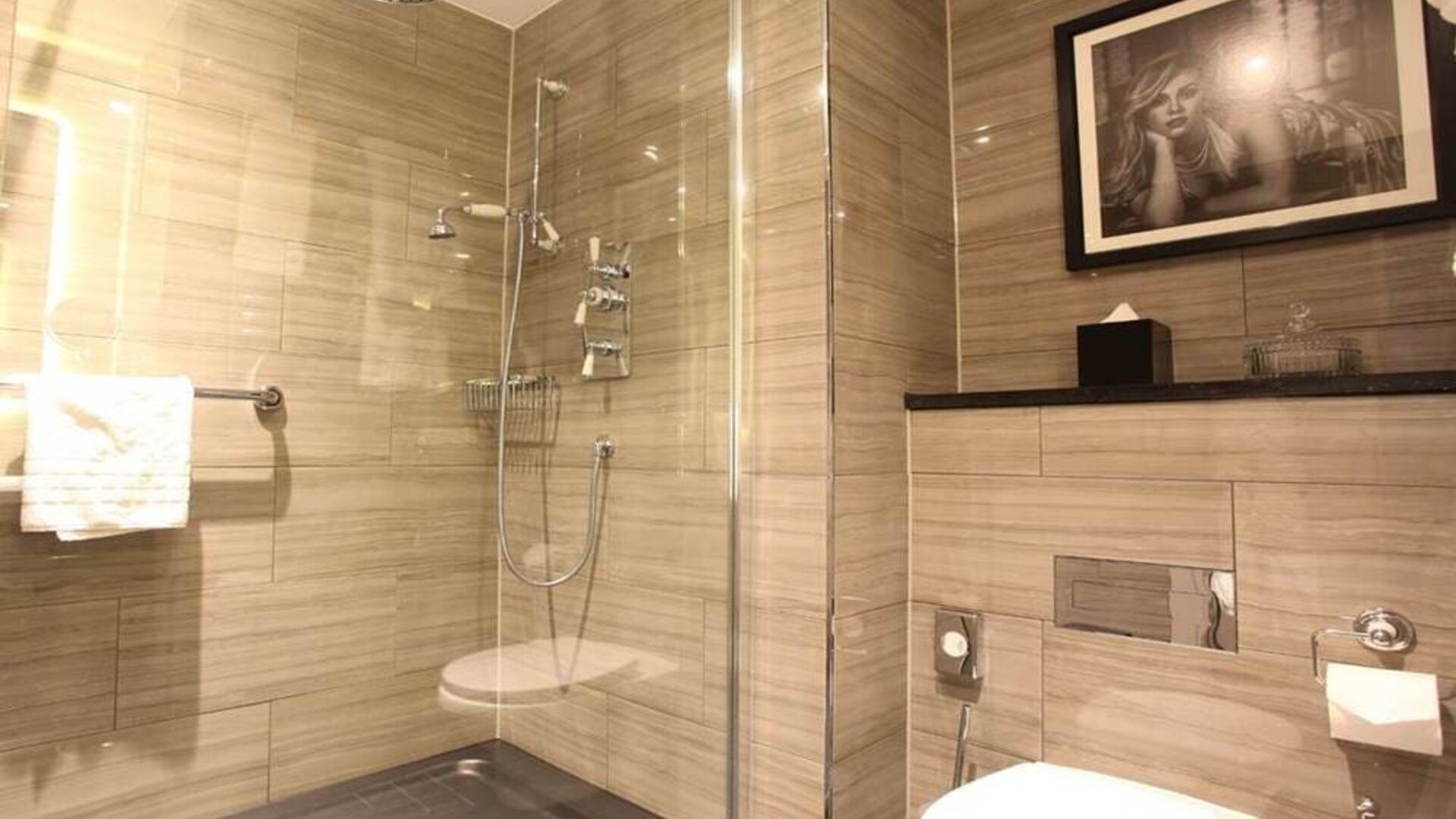 Guest bathroom with shower at Hotel Gotham.  