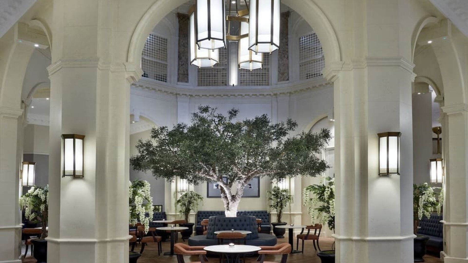 Bright lobby with arches and greeneries at The Midland - A Leonardo Royal Hotel.  