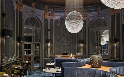 Intimate dining area with luxurious chandeliers at The Midland - A Leonardo Royal Hotel.