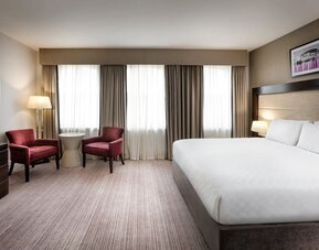 King bed with TV at Leonardo Hotel Cardiff.