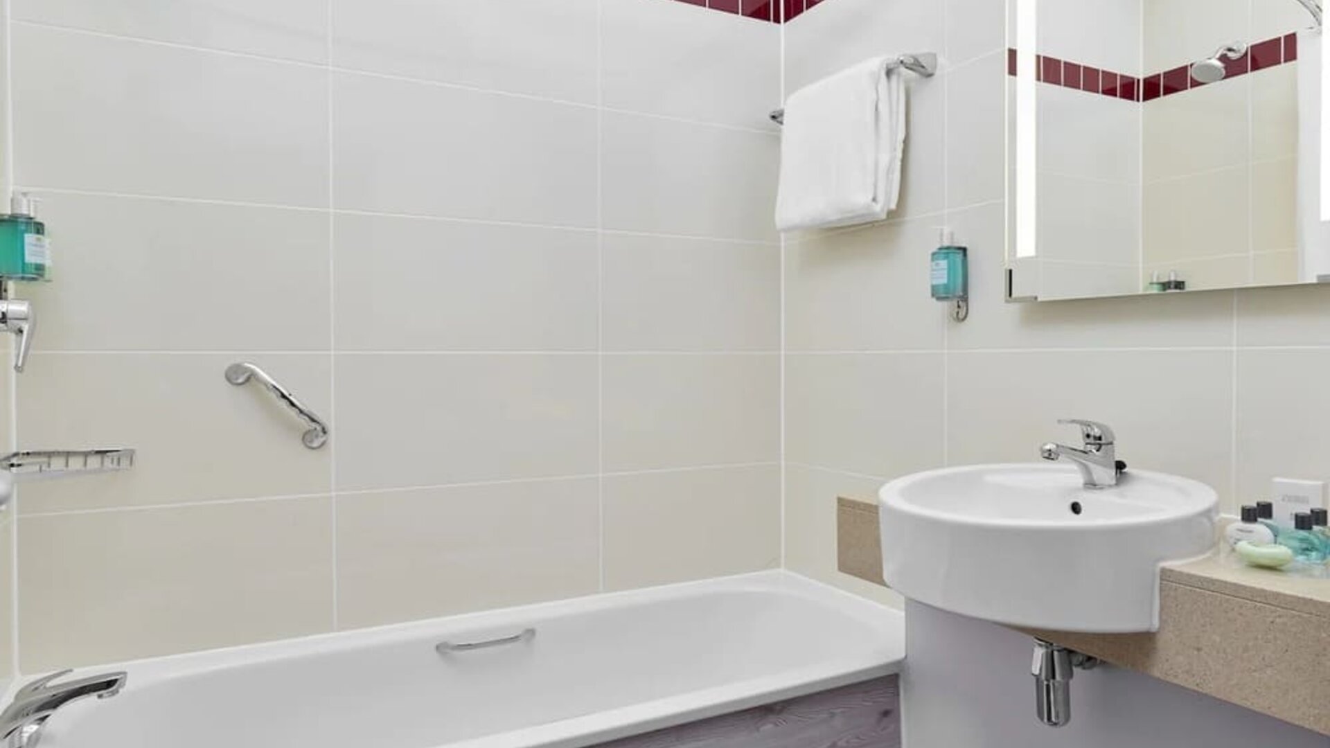 Guest bathroom with shower and tub at Leonardo Hotel Sheffield.