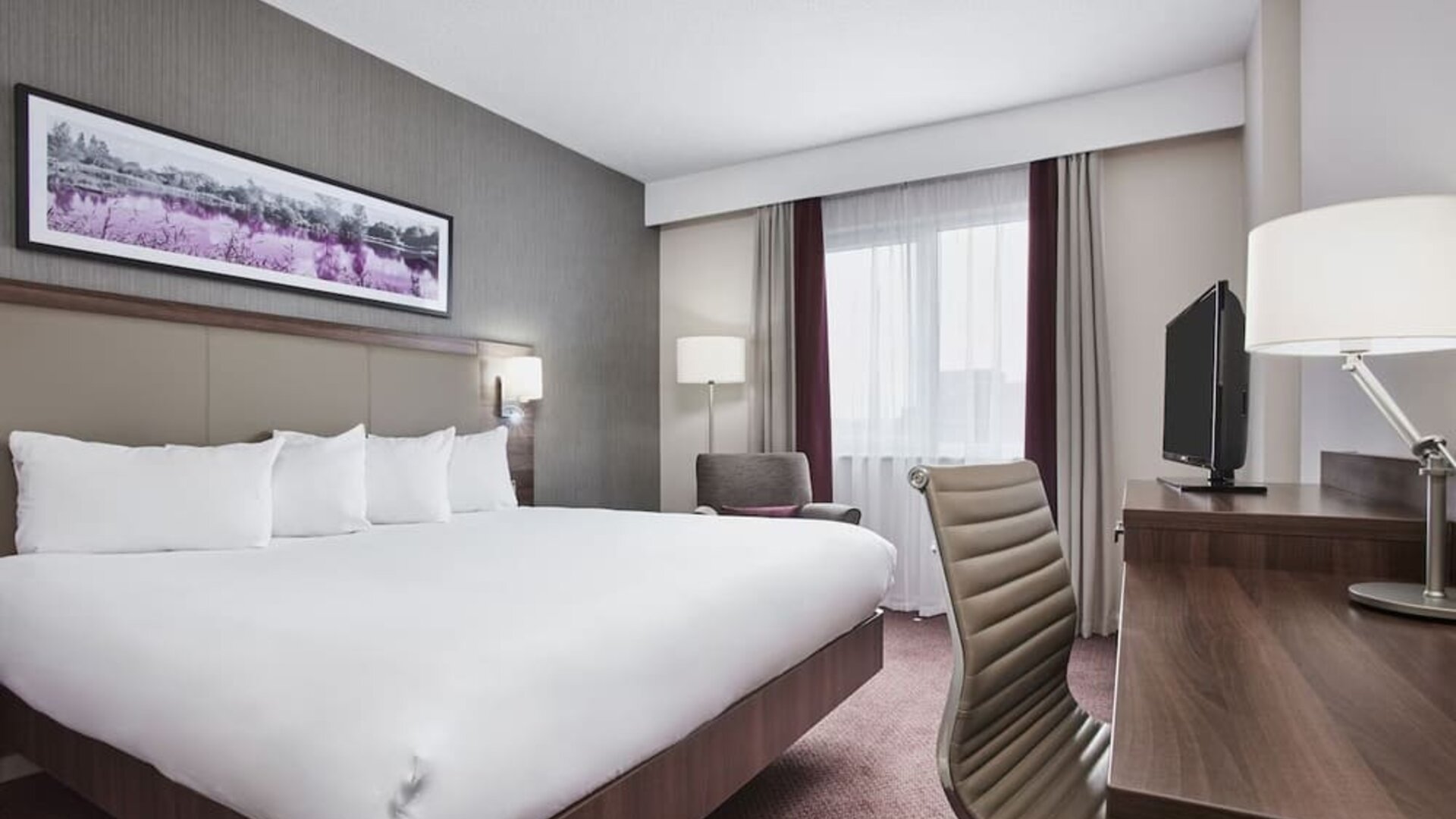 King suite with work desk at Leonardo Hotel Swindon.