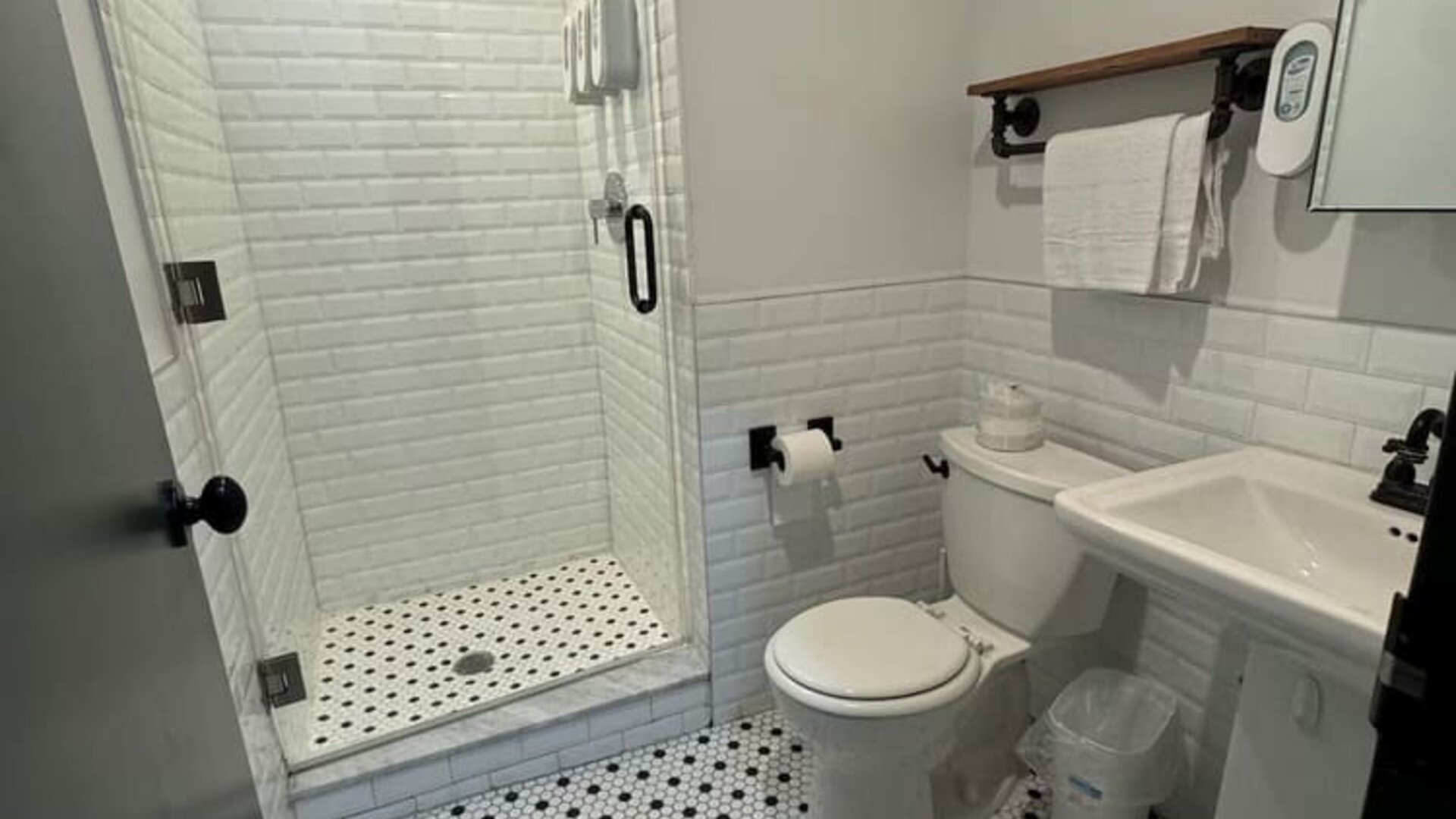 Guest bathroom with shower at Tribeca Hotel FiDi.