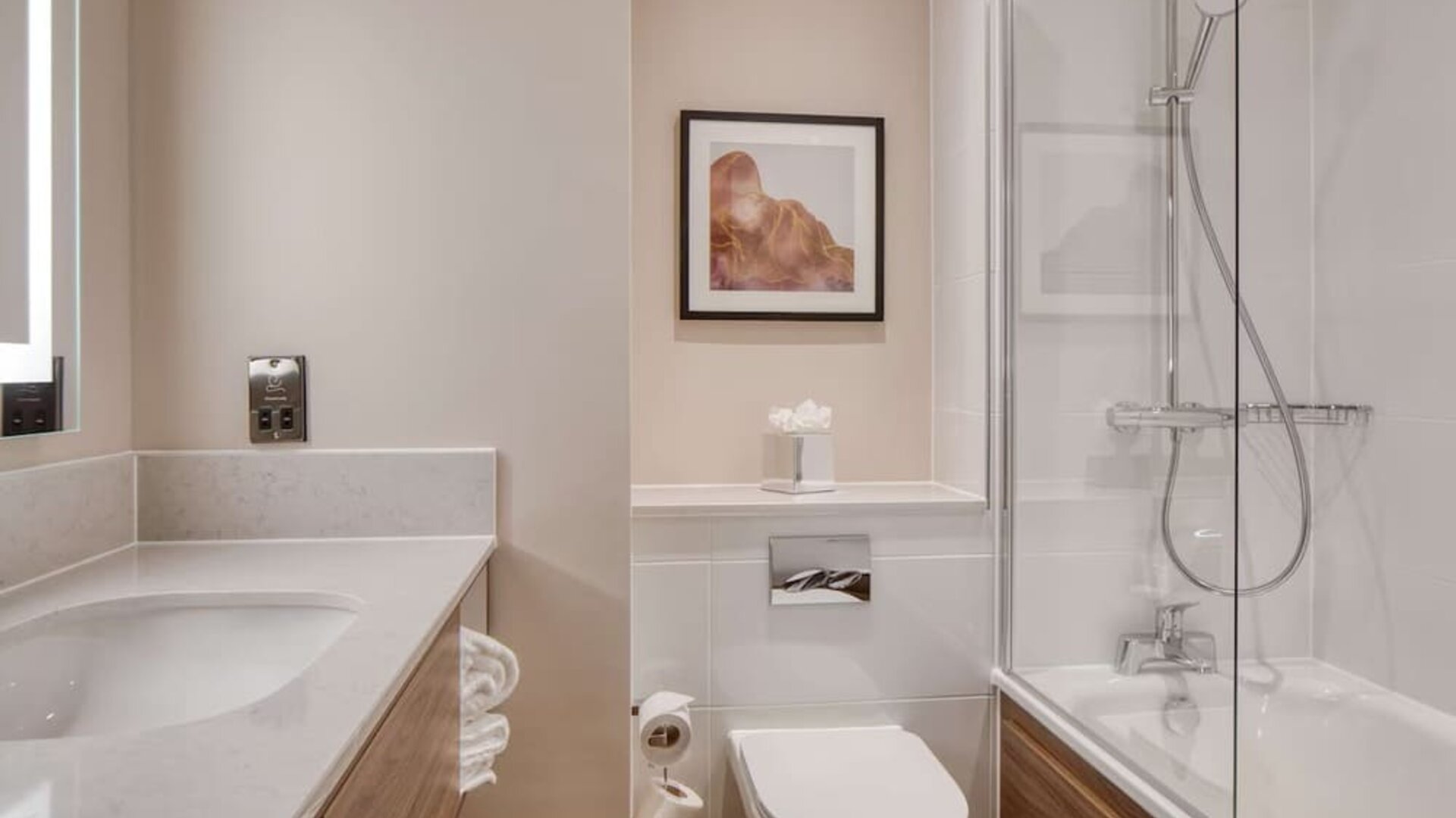 Guest bathroom with shower and tub at DoubleTree by Hilton Dartford Bridge.