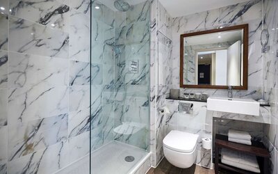Guest bathroom with shower at DoubleTree By Hilton London Excel.
