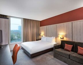 Day use room with sofa and large window at DoubleTree By Hilton London Excel.
