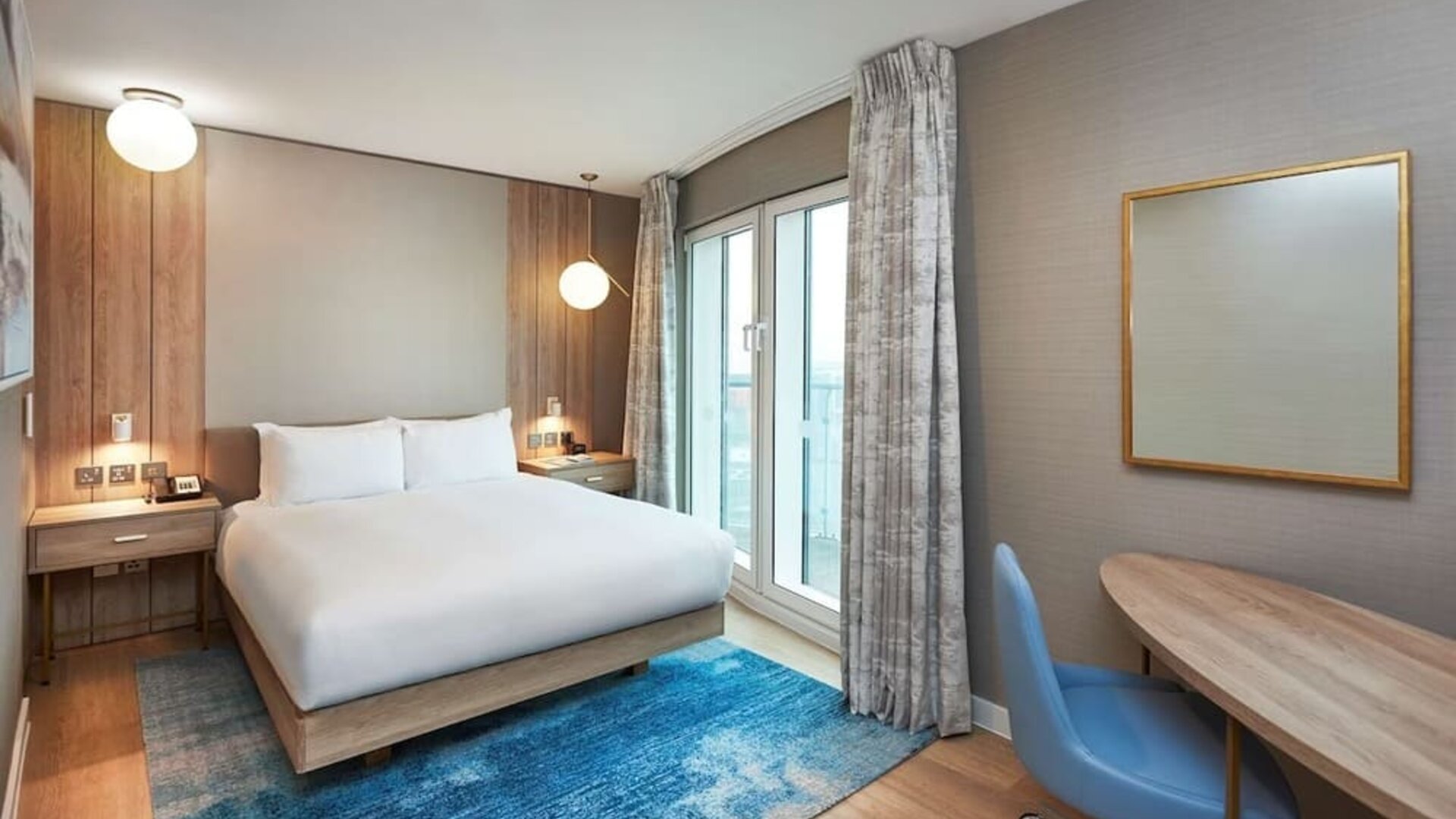 Day use room with work desk and balcony at DoubleTree By Hilton London Excel.